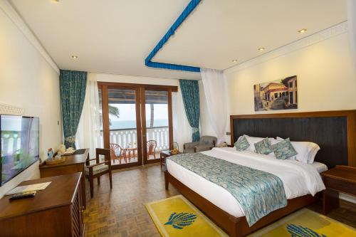 Krevet ili kreveti u jedinici u okviru objekta Travellers Beach Hotel