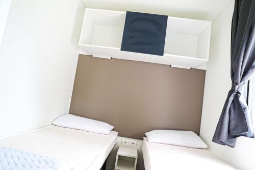 Una cama o camas en una habitación de Camping Rose