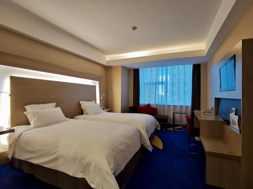 Krevet ili kreveti u jedinici u objektu Shenzhen Novotel Watergate(Kingkey 100)