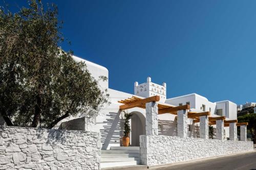 a white church with stairs and a tower at Rochari Hotel in Mýkonos City