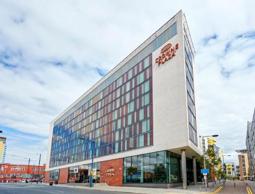 a building with a sign on the side of it at Crowne Plaza Manchester City Centre, an IHG Hotel in Manchester