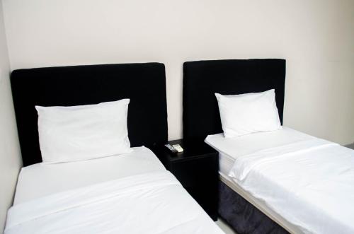 A bed or beds in a room at Residencial Horizonte 2