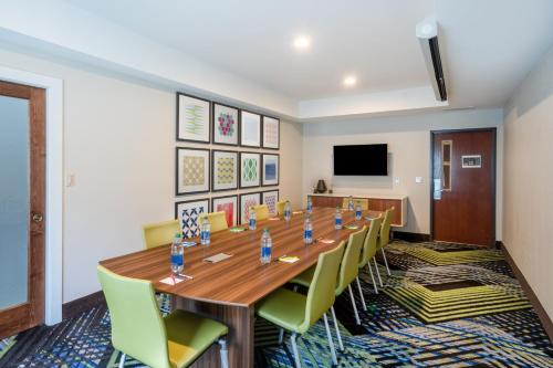 a conference room with a long table and chairs at Holiday Inn Express & Suites Tell City, an IHG Hotel in Tell City