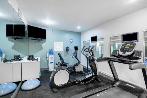 a gym with two elliptical machines in a room at Holiday Inn Express & Suites Tell City, an IHG Hotel in Tell City