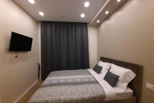 Apartamentai Giluzes Rivjera 객실 침대