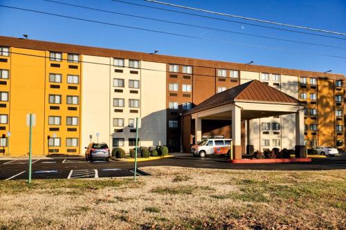 a building with a gazebo in front of a parking lot at Comfort Inn in Oxon Hill