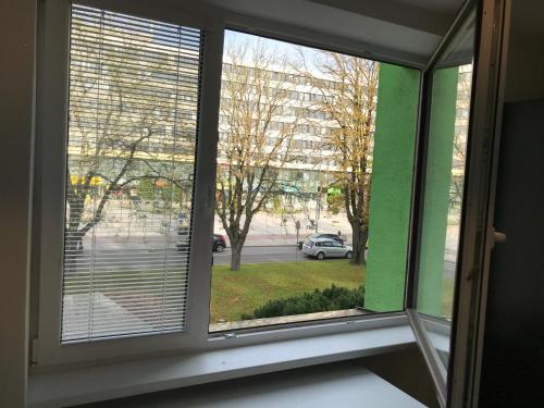 a window with a view of a street at Apartmán v úplnom centre in Vranov nad Topľou