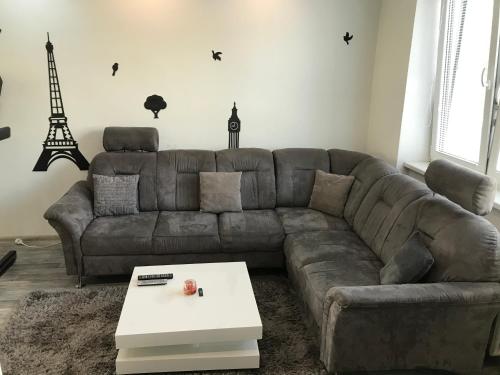 a living room with a couch and a coffee table at Apartmán v úplnom centre in Vranov nad Topľou