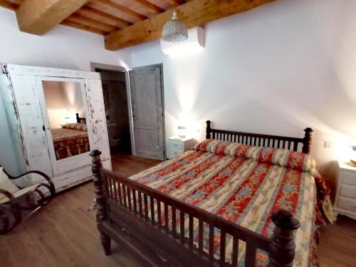 Cama ou camas em um quarto em Agriturismo MonteCrespini