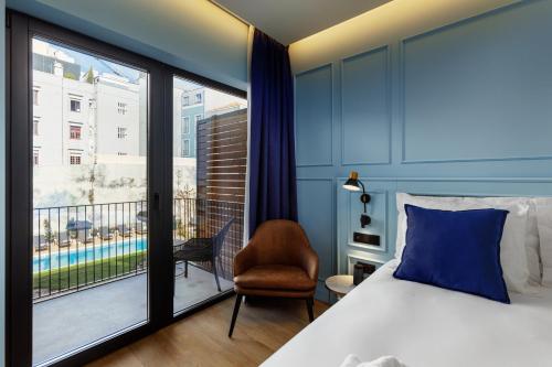 Giường trong phòng chung tại Mercure Porto Centro Aliados