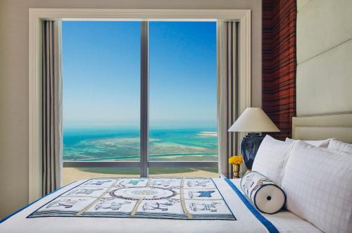 A bed or beds in a room at Four Seasons Hotel Bahrain Bay