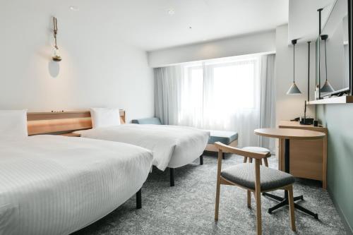 Lova arba lovos apgyvendinimo įstaigoje REF Omiya by VESSEL HOTELS