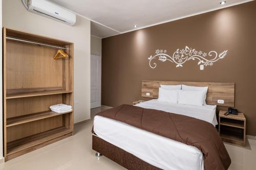 Кровать или кровати в номере Hotel Solec Piura