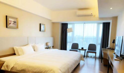 Yuwa Serviced Residence 객실 침대