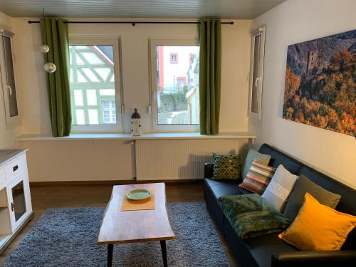 a living room with a couch and a coffee table at Villa Ammonit in Pottenstein