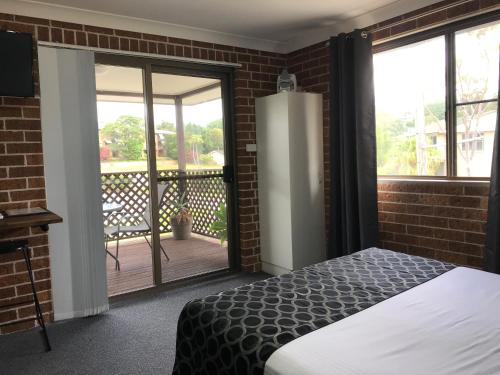 Krevet ili kreveti u jedinici u objektu Coffs Shearwater Motel