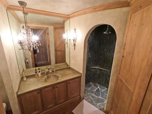 a bathroom with a sink and a shower at Beautiful apartment over the mountain in Crans-Montana