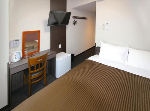 Hotel Trend Suzuka 객실 침대