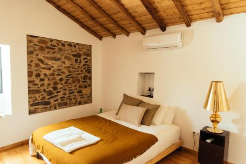 a bedroom with a bed in a room at Azeite de Marvão, Olivoturismo casa Venda do Lagar in Marvão