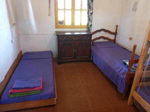 Gulta vai gultas numurā naktsmītnē Hostal Rural cerca del Cabo