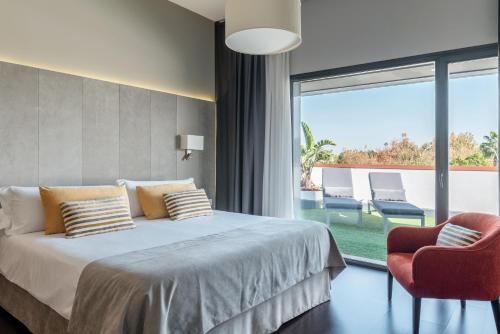 Rúm í herbergi á Sevilla Green Suites