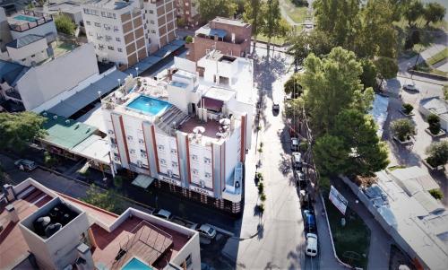 an overhead view of a building in a city at Hotel Arona in Villa Carlos Paz