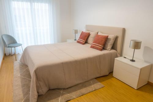 Una cama o camas en una habitación de Perola Mar