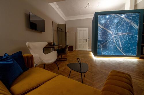 a living room with a large projection of a city at Le Baldinger Boutique Hotel in Bamberg