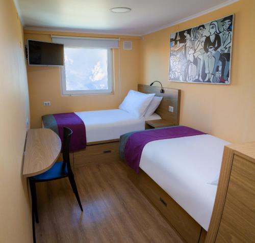 Ліжко або ліжка в номері Hotel Modular Express Calama