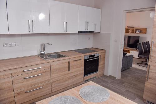 Кухня или кухненски бокс в Apartmán Lydie