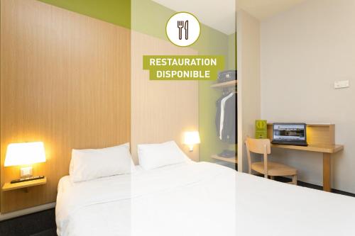 Posteľ alebo postele v izbe v ubytovaní B&B HOTEL Lyon Sud États-Unis