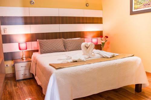 Ліжко або ліжка в номері Serk'ana Suite Hostal