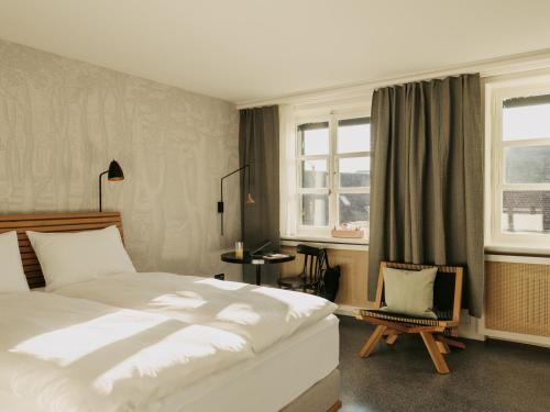 Tempat tidur dalam kamar di Boutique & Design Hotel Volkshaus Basel