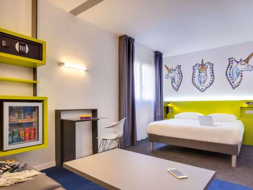 Posteľ alebo postele v izbe v ubytovaní ibis Styles Nantes Centre Gare