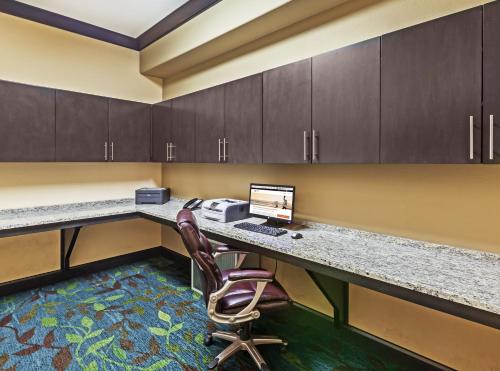 an office with a desk with a computer and a chair at Candlewood Amarillo-Western Crossing, an IHG Hotel in Amarillo