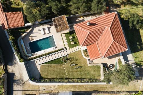 an overhead view of a house with a swimming pool at OD Luxury Villa in Pylos