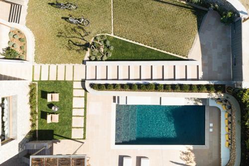 an overhead view of a building with a swimming pool at OD Luxury Villa in Pylos