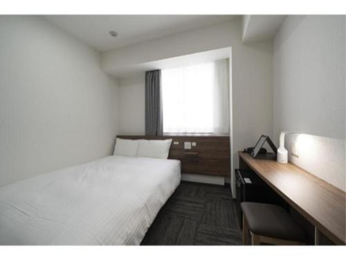 Tempat tidur dalam kamar di R&B Hotel Nagoya Ekimae - Vacation STAY 15184v