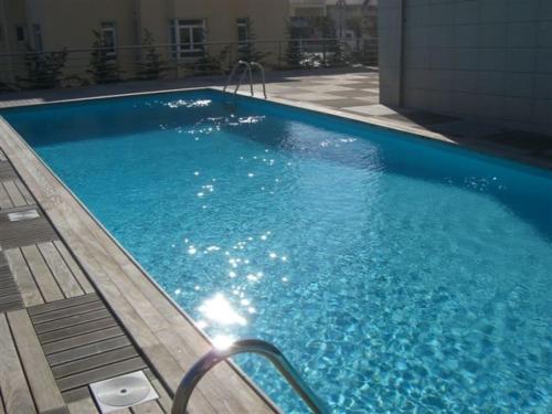 Piscina de la sau aproape de Bay Residence Apartamento - Piscina