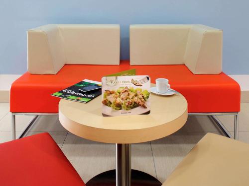 a table with a plate of food on it at ibis Southampton in Southampton