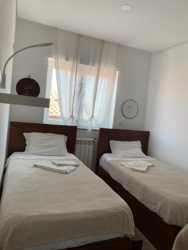 A bed or beds in a room at The Spot Hostel Ofir