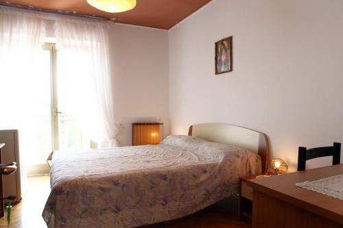 Giường trong phòng chung tại Rooms Torcello - with shared bathroom