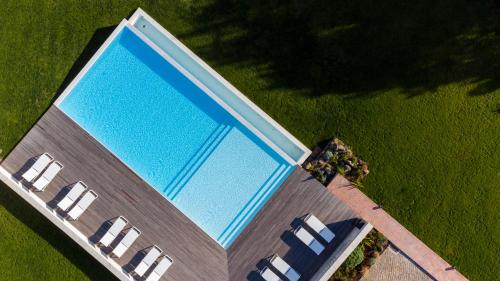 an overhead view of a swimming pool in a building at Ericeira Prime Villas in Ericeira