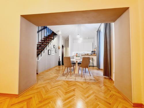 a dining room and kitchen with a table and chairs at Cicibela Apartment - Zadar in Zadar