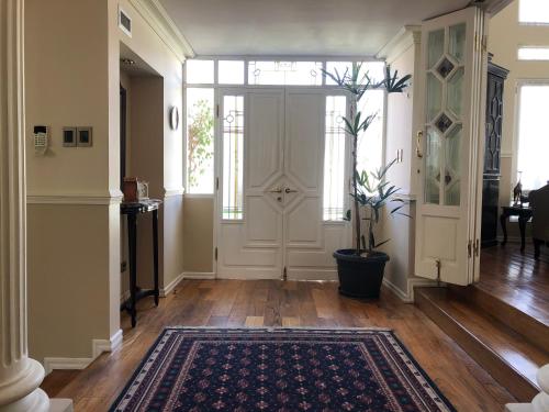 a hallway with a door and a potted plant at B&B 518 in La Paz