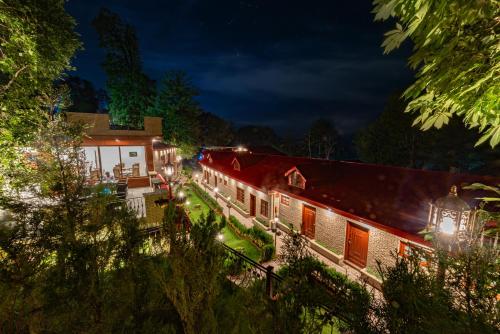 an exterior view of a building at night at Khattak Lodge Murree in Murree