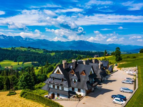 an aerial view of a large house on a hill at Willa Majerczyk in Poronin