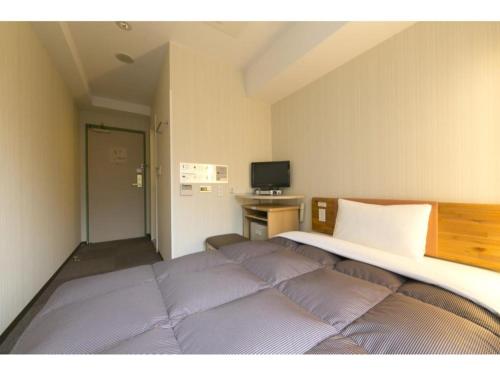 TV tai viihdekeskus majoituspaikassa R&B Hotel Umeda East - Vacation STAY 40693v