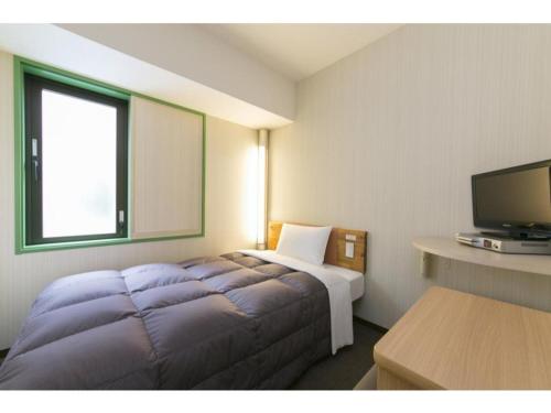 TV tai viihdekeskus majoituspaikassa R&B Hotel Umeda East - Vacation STAY 40693v