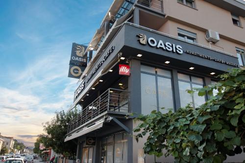 een gebouw met een bord aan de zijkant bij OASIS Apartments in Gevgelija